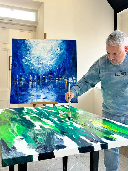 A person painting a picture

AI-generated content may be incorrect.