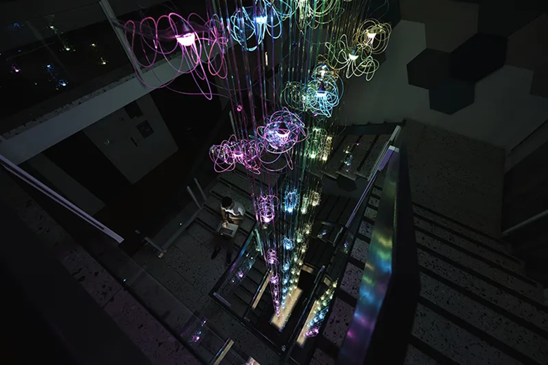 A group of colorful lights from a staircase

AI-generated content may be incorrect.